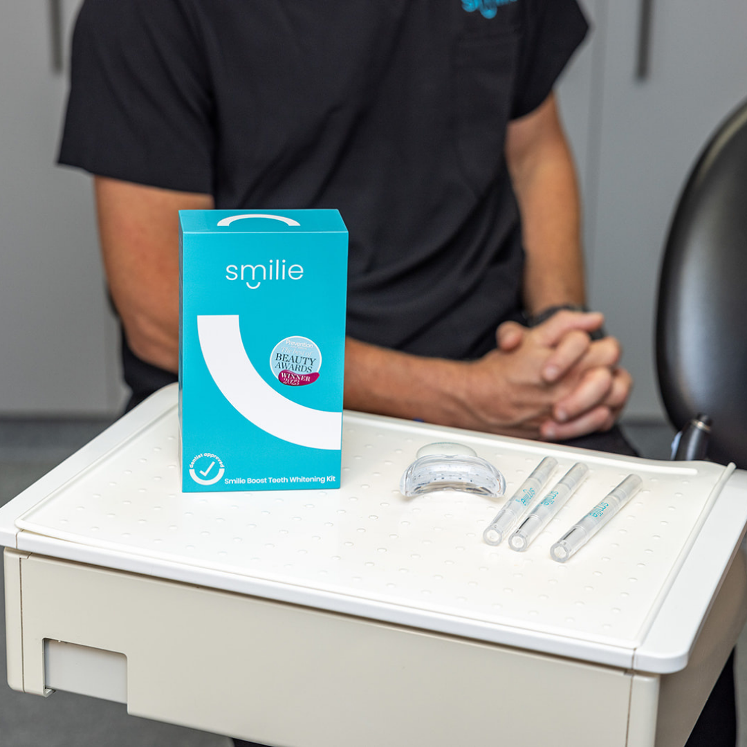Smilie Boost Kit contents – LED device, whitening pens, USB cable, shade guide